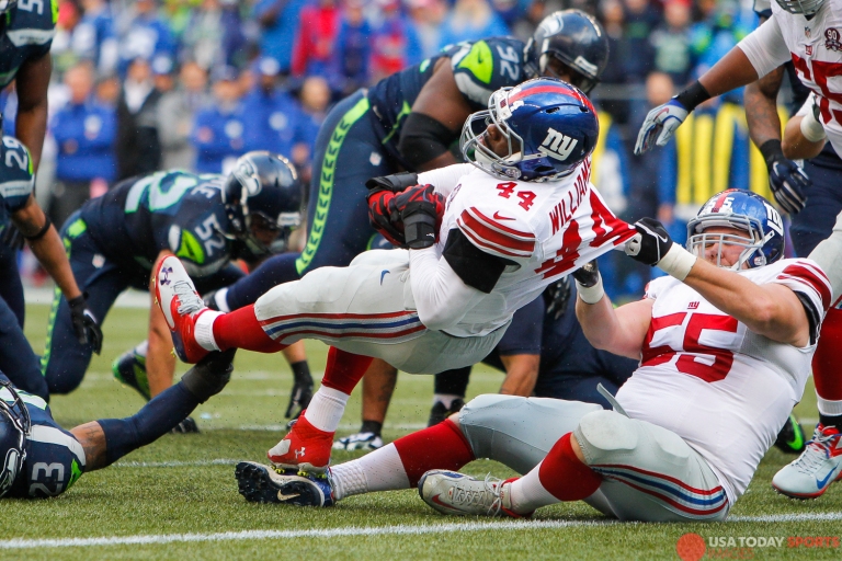 Nov 9, 2014; Seattle, WA, USA; New York Giants running back Andre Williams (44) rushes for a touchdown against the Seattle Seahawks with the help of New York Giants center J.D. Walton (55) during the second quarter at CenturyLink Field. Mandatory Credit: Joe Nicholson-USA TODAY Sports