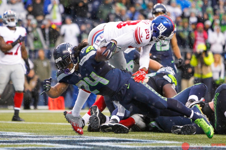 Nov 9, 2014; Seattle, WA, USA; Seattle Seahawks running back Marshawn Lynch (24) rushes for a touchdown against the New York Giants during the fourth quarter at CenturyLink Field. Mandatory Credit: Joe Nicholson-USA TODAY Sports