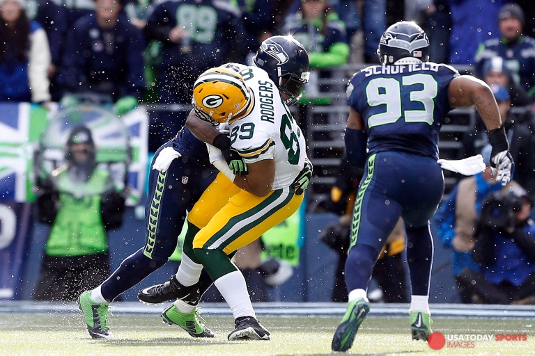 Jan 18, 2015; Seattle, WA, USA; Seattle Seahawks strong safety Kam Chancellor (31) tackles Green Bay Packers tight end Richard Rodgers (89) after Rodgers made a reception during the first quarter in the NFC Championship game at CenturyLink Field. Mandatory Credit: Joe Nicholson-USA TODAY Sports
