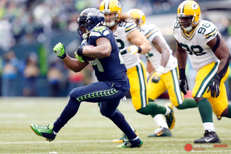 Jan 18, 2015; Seattle, WA, USA; Seattle Seahawks running back Marshawn Lynch (24) rushes against the Green Bay Packers during the second quarter in the NFC Championship game at CenturyLink Field. Mandatory Credit: Joe Nicholson-USA TODAY Sports