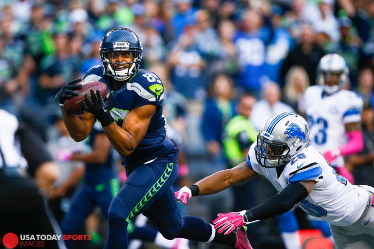 Oct 5, 2015; Seattle, WA, USA; Seattle Seahawks wide receiver Doug Baldwin (89) catches a touchdown pass against Detroit Lions cornerback Quandre Diggs (28) during the second quarter at CenturyLink Field. Mandatory Credit: Joe Nicholson-USA TODAY Sports
