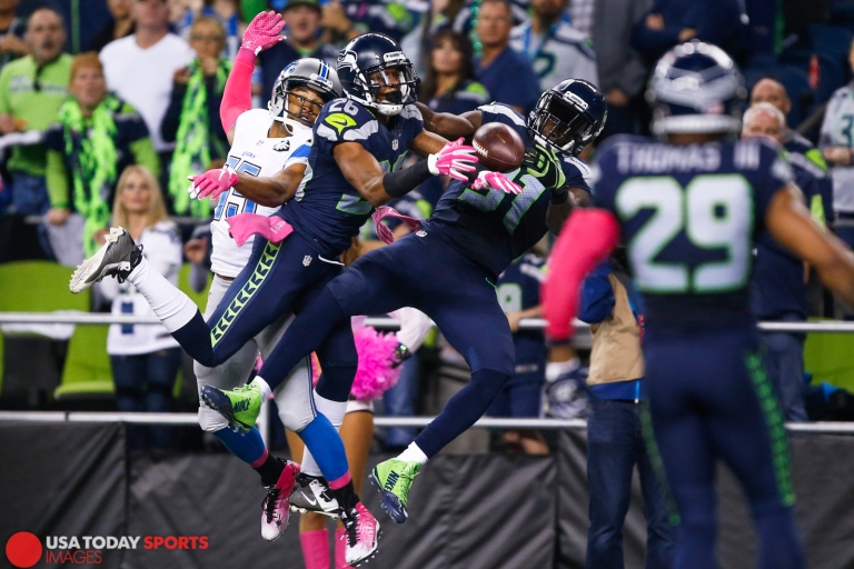 Oct 5, 2015; Seattle, WA, USA; Seattle Seahawks cornerback Cary Williams (26) and strong safety Kam Chancellor (31) defend a pass intended for Detroit Lions wide receiver Golden Tate (15) during the third quarter at CenturyLink Field. Seattle defeated Detroit, 13-10. Mandatory Credit: Joe Nicholson-USA TODAY Sports